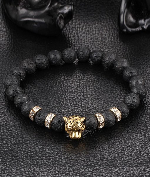 Handgjort armband guld leopard svarta lavastenar